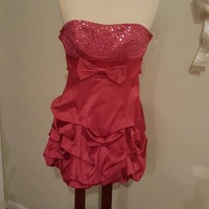 Strapless Fuscia pink mini dress with ruffles.